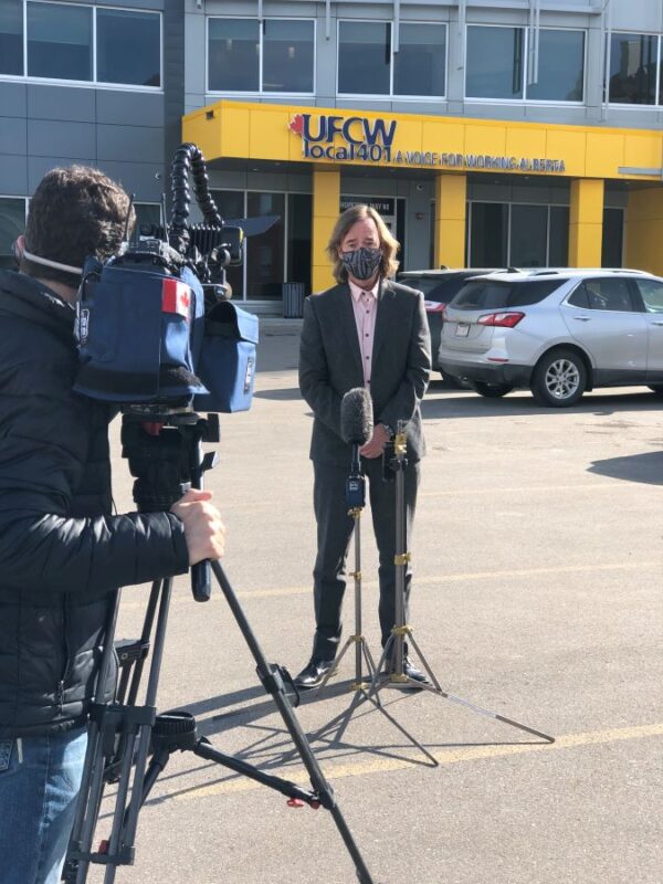 President Thomas Hesse speaks to the media outside the UFCW 401 Calgary office.