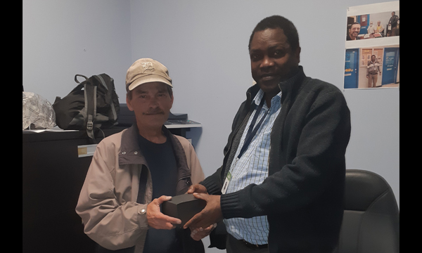 James receives his retirement gift from his union Walking Steward Joseph
