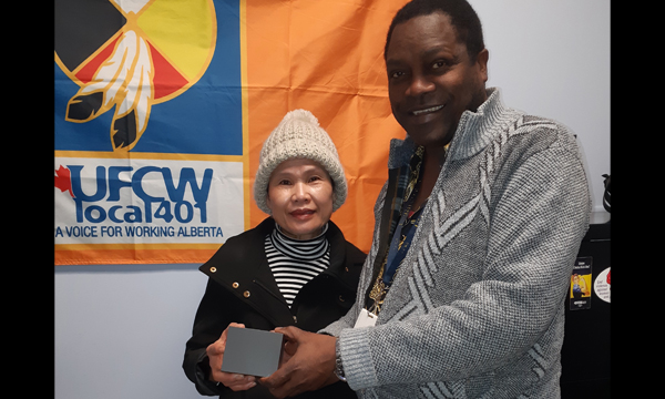 Nam receives her retirement gift from her Walking Steward Joseph