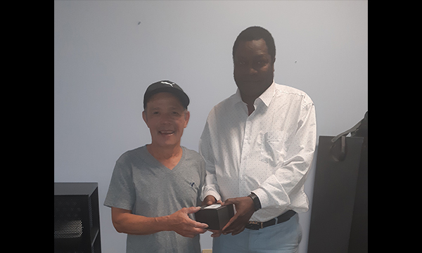 Long (L) receives his UFCW 401 retirement watch from his Walking Steward Joseph