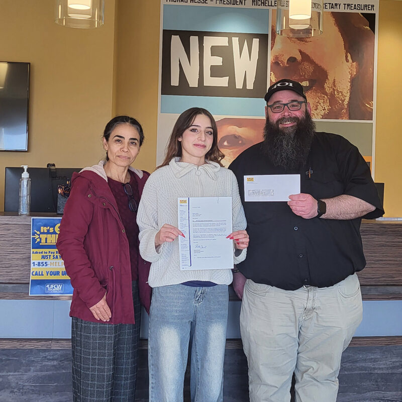 Matt Gilks presents Rosario Molina, winner of the 2024 Grant Notley Memorial Scholarship her cheque.