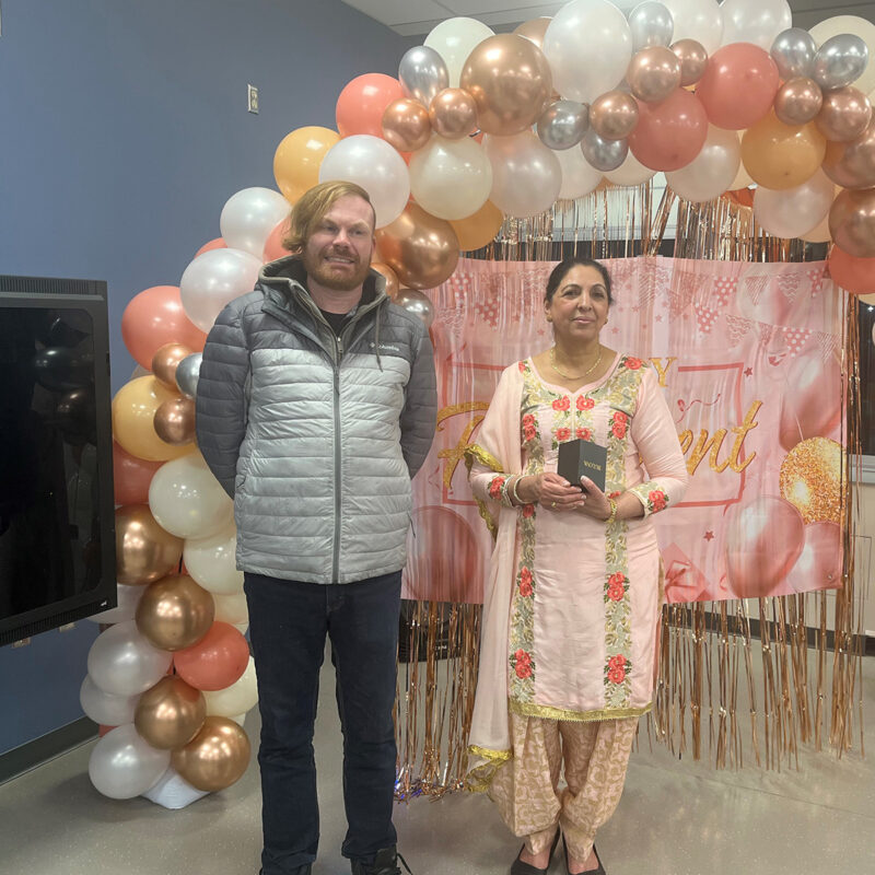 Jeff Ible presents Surjit Kaur with her retirement watch.